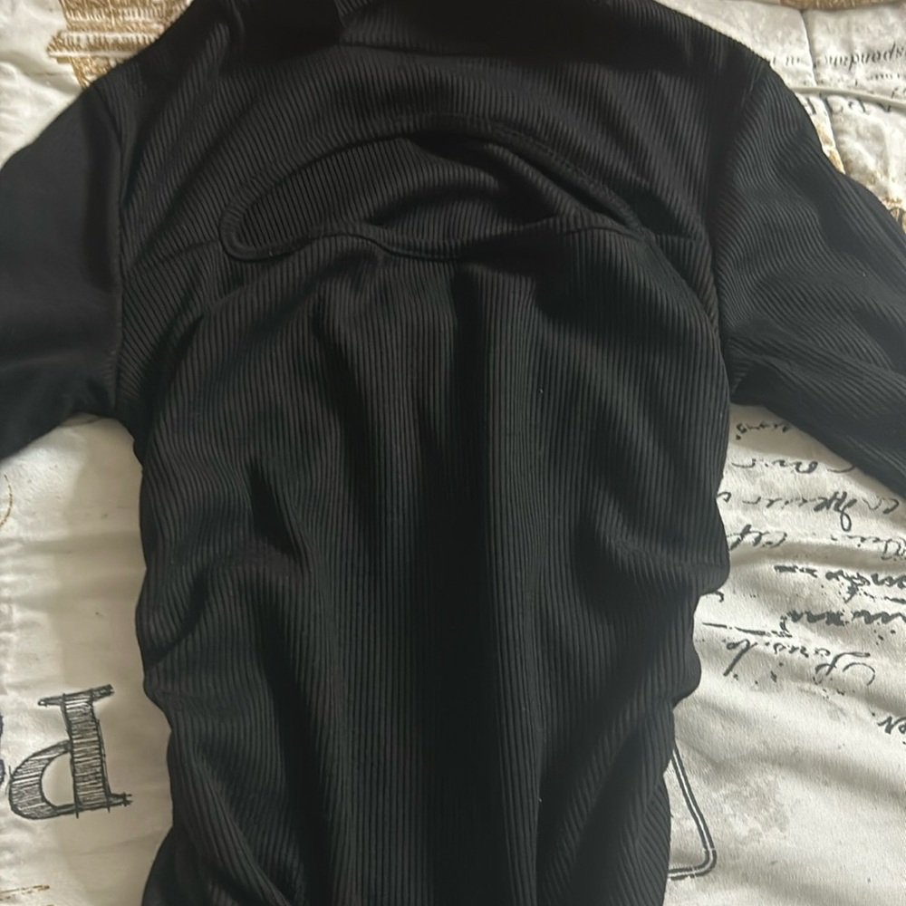 Black mid dress with stacked arms and scrunchie bottoms